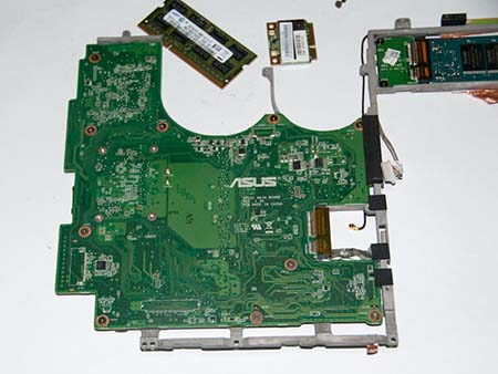 Remove the screws holding the motherboard to metal frame