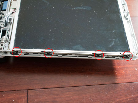 Remove four screws on each side of the LCD